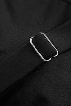 Adjustable strap detail on black tankini swimsuit with metal slider for customizable fit and support.