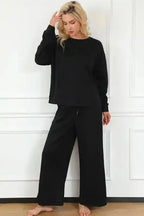 Casual black slouchy loungewear set for women with wide-leg pants and loose-fit top, perfect for winter comfort and daily errands.