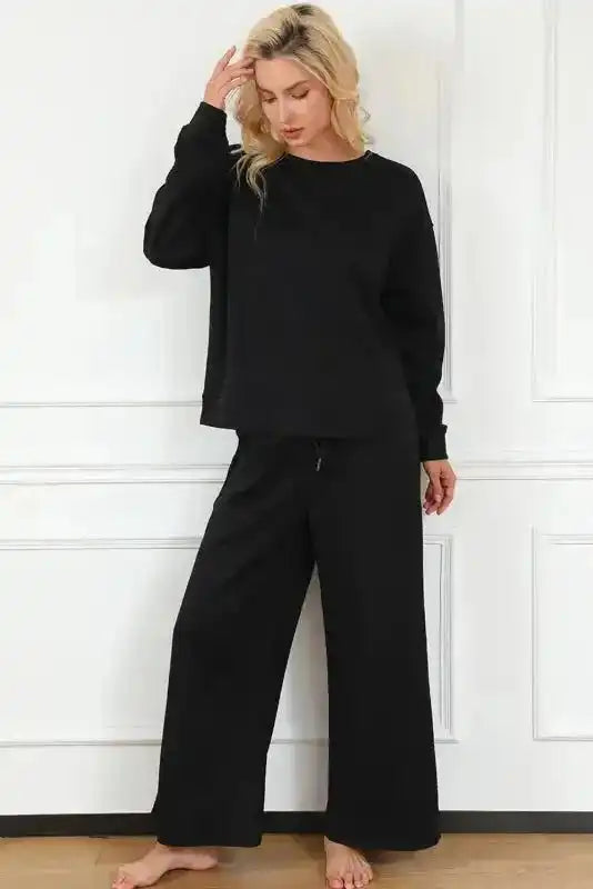 Casual black slouchy loungewear set for women with wide-leg pants and loose-fit top, perfect for winter comfort and daily errands.