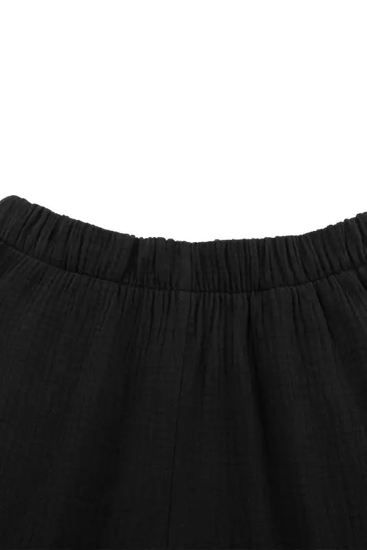 Black textured high waist ruffled bell bottom pants - wide leg