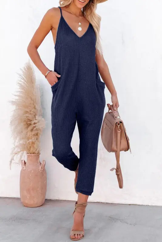 Black textured sleeveless v-neck pocketed casual jumpsuit - jumpsuits & rompers