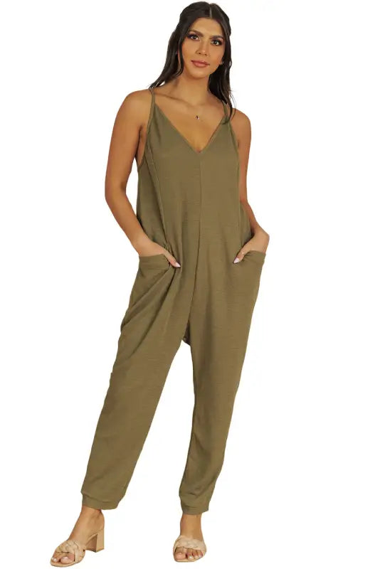 Black textured sleeveless v-neck pocketed casual jumpsuit - jumpsuits & rompers