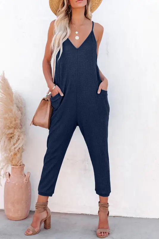 Black textured sleeveless v-neck pocketed casual jumpsuit - jumpsuits & rompers