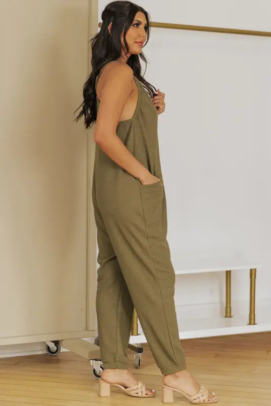 Black textured sleeveless v-neck pocketed casual jumpsuit - jumpsuits & rompers