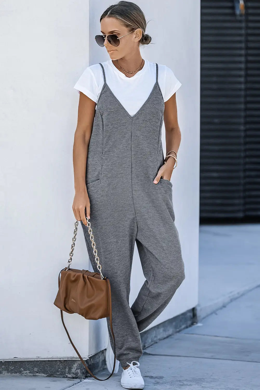 Black textured sleeveless v-neck pocketed casual jumpsuit - jumpsuits & rompers