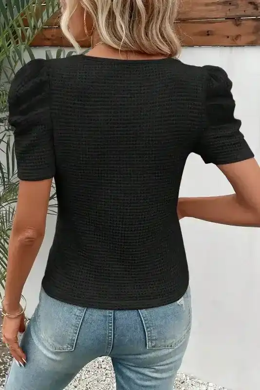 Back view of Black Waffle Knit Ruched Puff Sleeve Top showing waffle texture silhouette and short sleeve — Fashionfitz