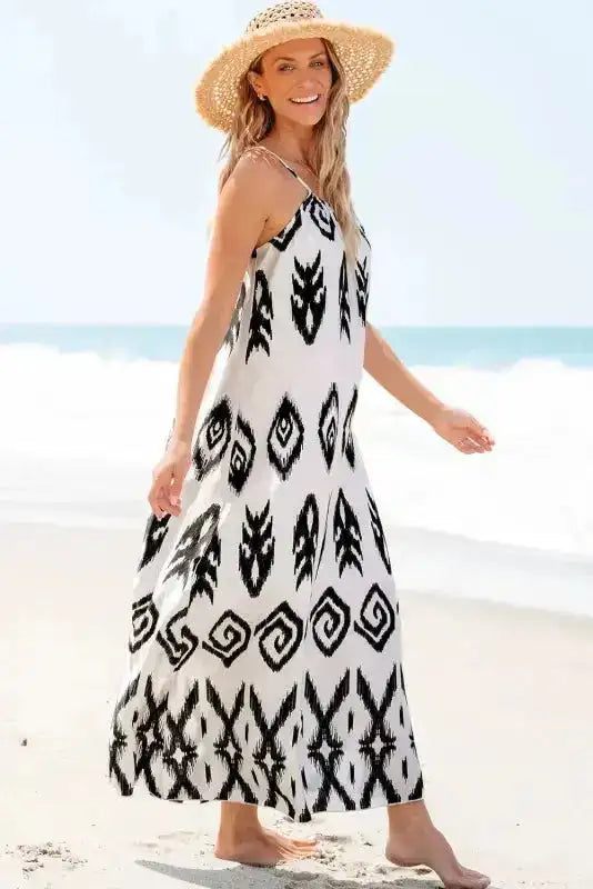 Model walking on the beach in a White Aztec Print Western Sundress, perfect for warm-weather layering and boho vacation looks.