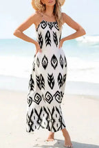 White Aztec Print Western Sundress styled with a straw hat, highlighting its breezy fit and bold black geometric patterns.