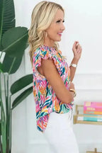 Side profile of Pink Floral Flutter Sleeve Blouse highlighting flutter sleeve detail and relaxed fit for casual summer outfits.