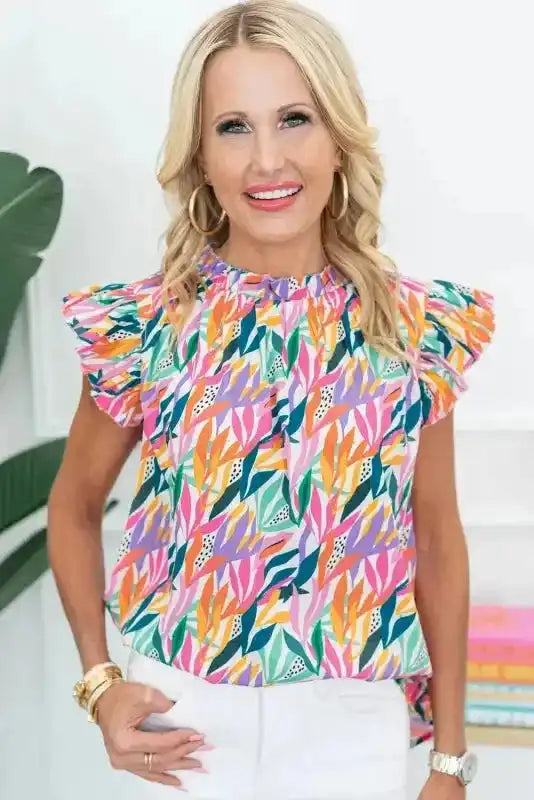 Front view of Pink Floral Flutter Sleeve Blouse with colorful floral pattern and gathered neckline, styled for a feminine look.