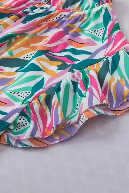 Close-up of flutter sleeve detail on Pink Floral Blouse with colorful floral pattern and soft ruffle trim for a feminine touch.