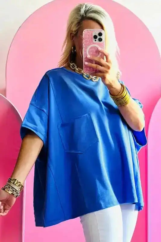 Back view of Blue Oversized Patched Pocket Exposed Seam T-Shirt showing exposed seam construction and relaxed fit — Fashionfitz