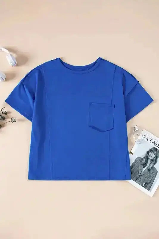Close-up of Blue Oversized Patched Pocket T-Shirt showing artisan patched pocket and exposed seam construction — Fashionfitz