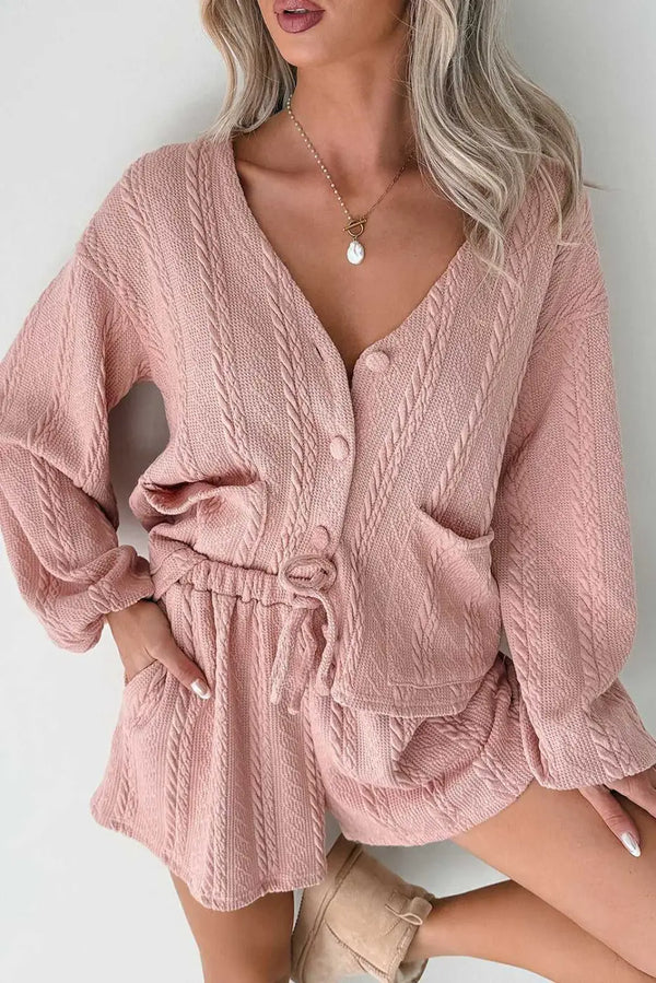 Blush Pink Cable Knit Co‑Ord featuring a V-neck cardigan with front buttons and drawstring shorts, ideal for cosy spring loungewear.