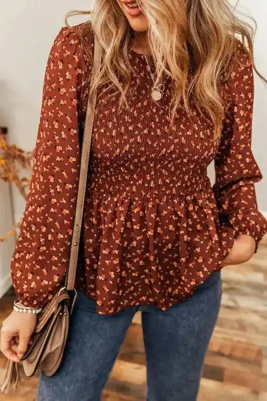 Boho Floral Peplum Blouse paired with casual denim, highlighting its whimsical floral print and peplum hem.