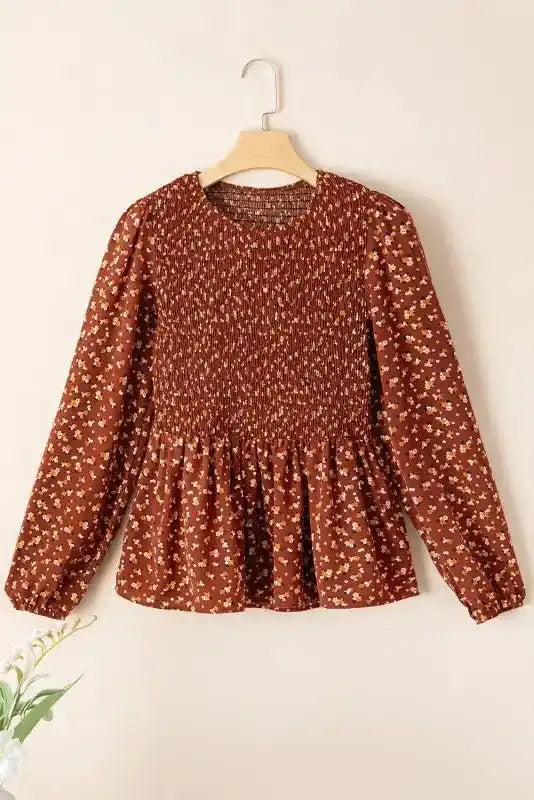 Boho Floral Peplum Blouse on hanger, showcasing full front view with floral print and gathered waist.