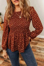 Boho Floral Peplum Blouse in rust brown with long sleeves and smocked bodice, styled with jeans for a unique feminine look.