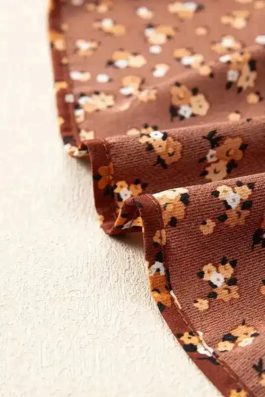 Edge seam detail of Boho Floral Peplum Blouse showing quality stitching and floral fabric finish.