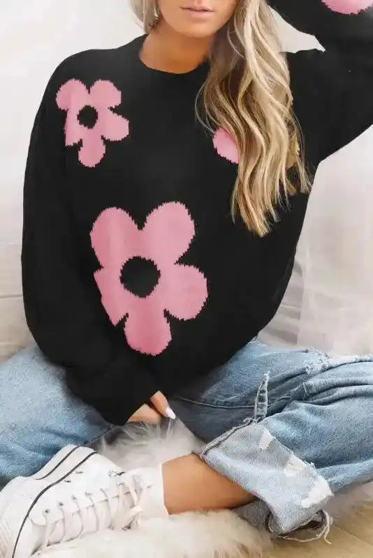 Bonbon Plus black floral sweater with pink flowers, styled with ripped jeans and sneakers for a cozy, casual autumn outfit.