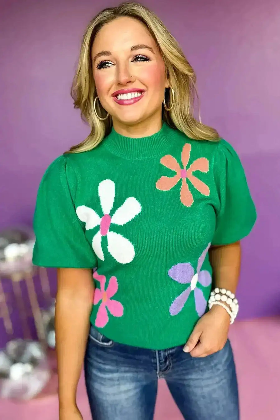 Women's short sleeve sweater in bright green with vintage floral print and puff sleeves, styled for a trendy casual look.