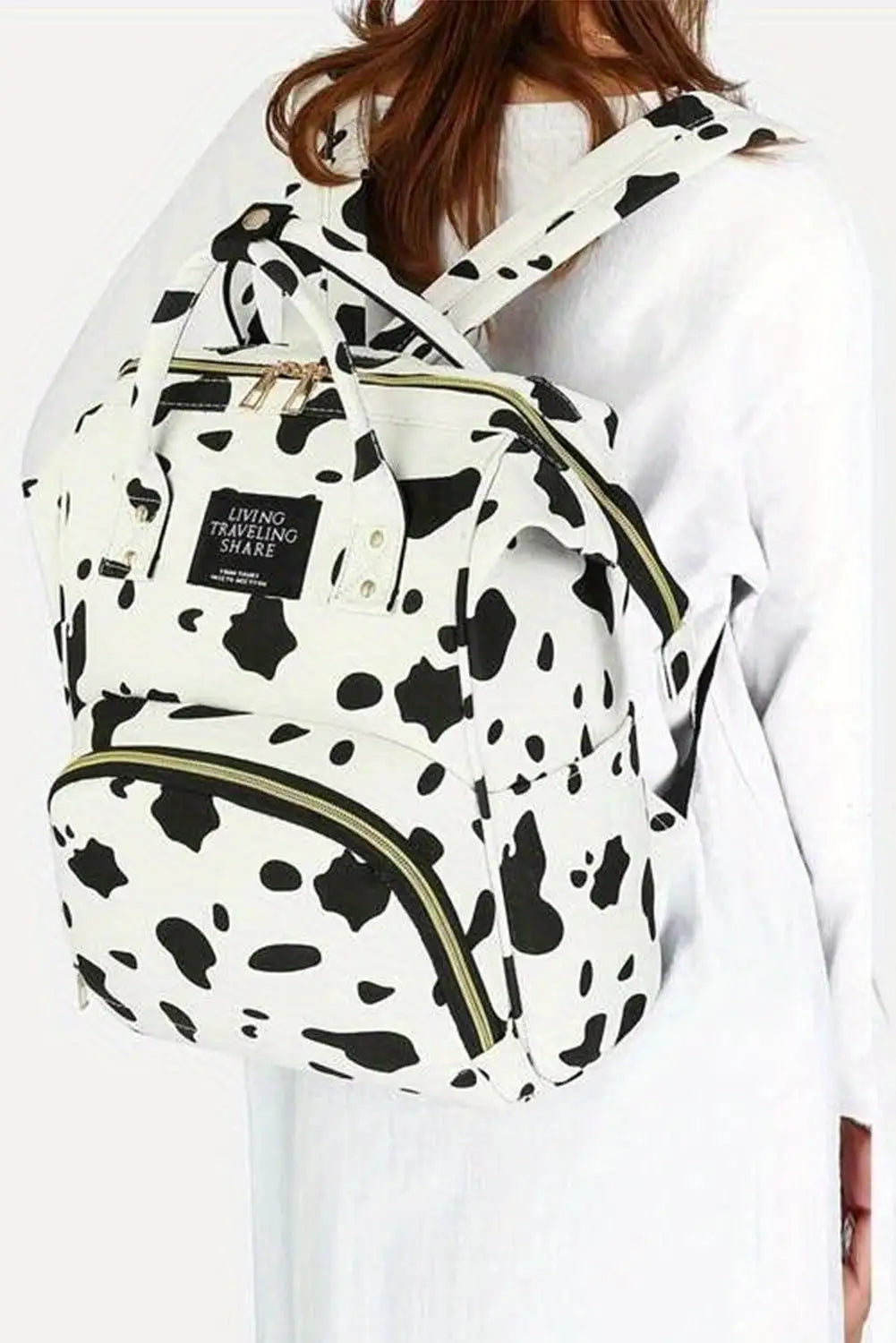 Bright white cow spot print multi pocket canvas backpack -