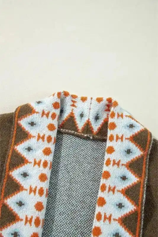 Detailed collar view of Brown Aztec Print Cardigan - Bohemian Style featuring orange and white tribal knit pattern.