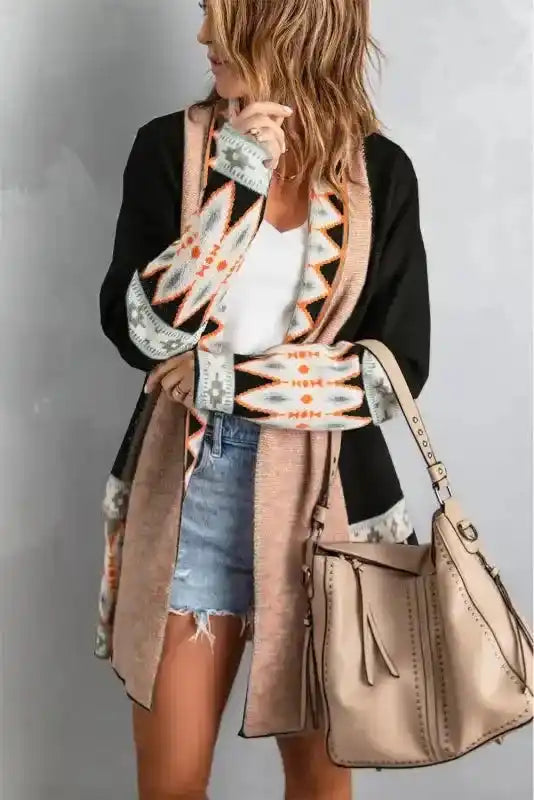 Side view of black Brown Aztec Print Cardigan with tribal print, styled with tan handbag and casual outfit for fall fashion.