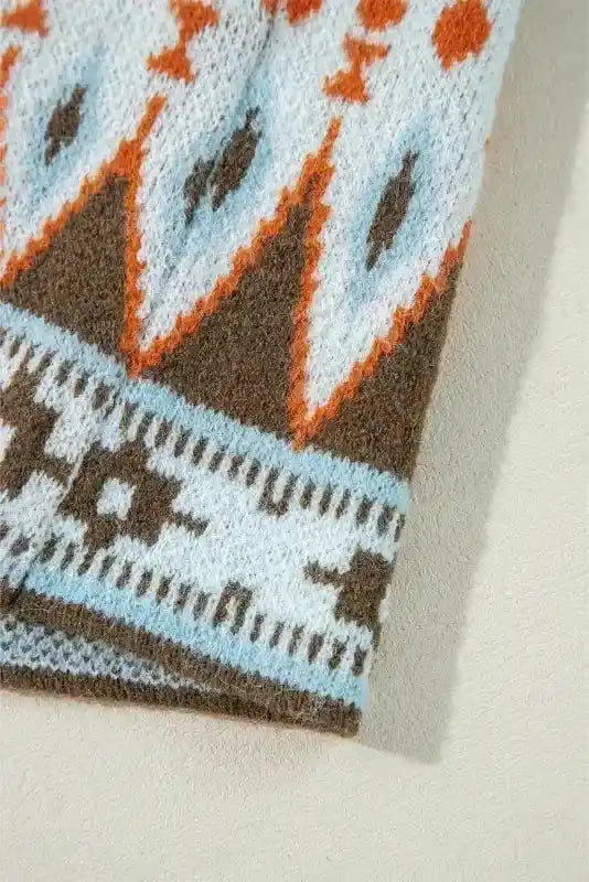 Cuff close-up of Brown Aztec Print Cardigan - Bohemian Style with blue, orange, and white tribal pattern on brown knit.