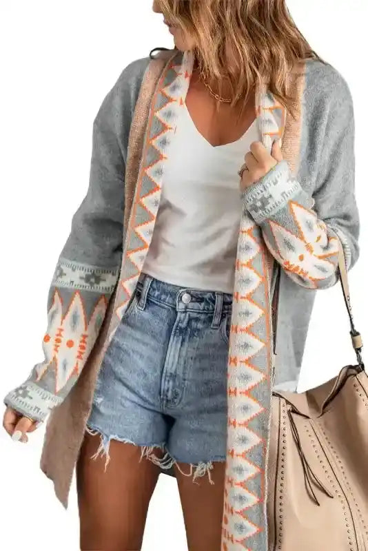 Gray Aztec Print Cardigan with peach-toned trim and geometric patterns, ideal for layering in fall and winter wardrobes.