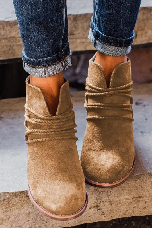 Brown criss cross slip-on point toe heeled boots