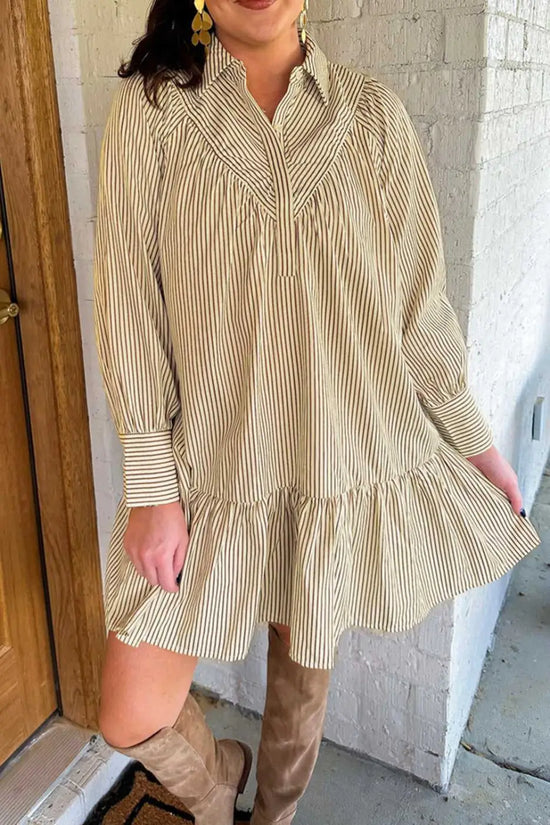 Model wearing Brown Stripe Mini Dress paired with knee-high boots. A breezy, casual style for fall fashion lovers.
