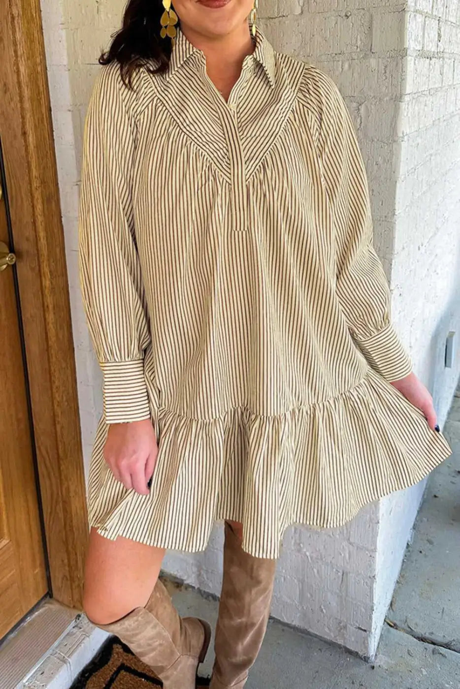 Model wearing Brown Stripe Mini Dress paired with knee-high boots. A breezy, casual style for fall fashion lovers.