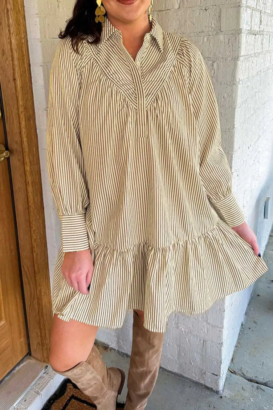 Model wearing Brown Stripe Mini Dress paired with knee-high boots. A breezy, casual style for fall fashion lovers.