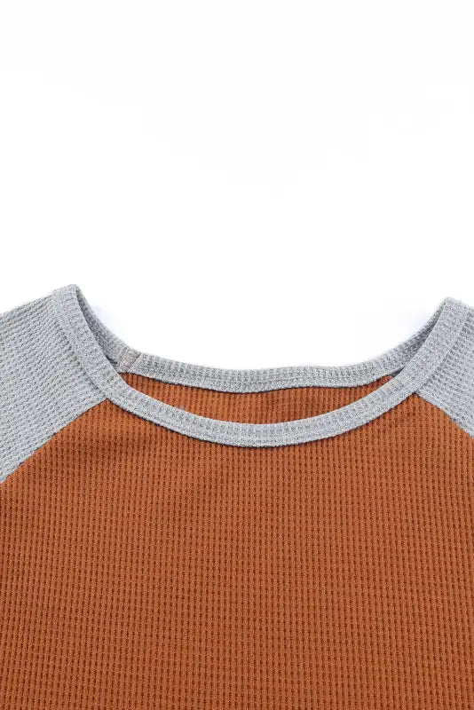 Rust-colored waffle knit dress with gray collar and raglan sleeves for a relax relax style