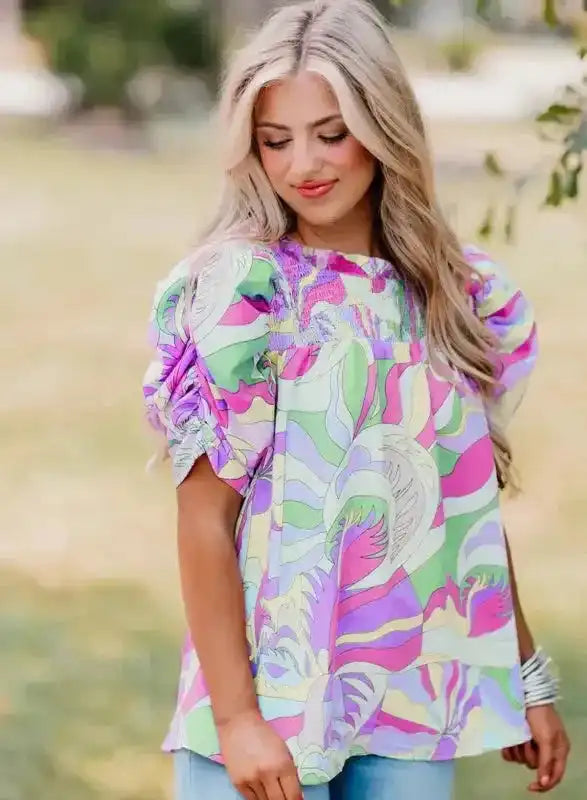 Side view of Abstract Print Bubble Sleeve Smocked Blouse showing fluid fit and bubble sleeve shape — Fashionfitz
