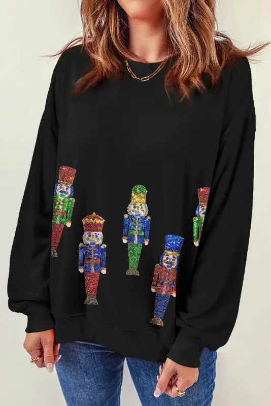 Burgundy sequined nutcracker doll contrast sleeve knit top - graphic