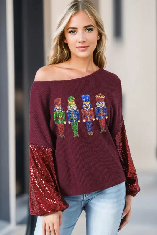 Burgundy sequined nutcracker doll contrast sleeve knit top - graphic