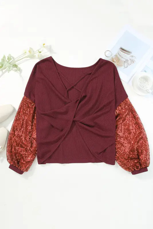 Burgundy sequined nutcracker doll contrast sleeve knit top - graphic