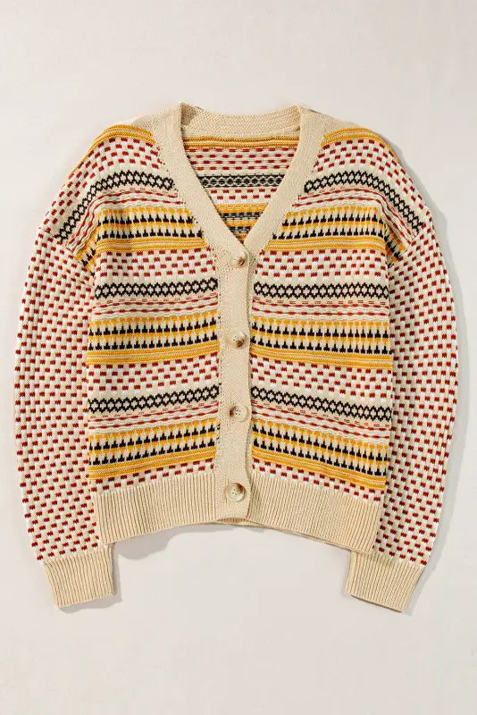 Buttoned cropped cardigan with geometric patterns in beige, yellow, red, black; relax relax