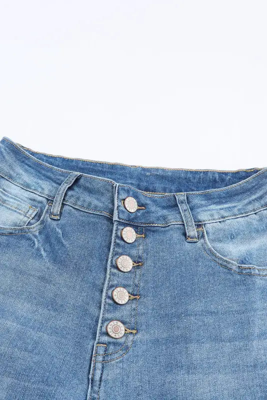 Buttoned distressed flared jeans