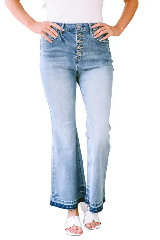 Buttoned distressed flared jeans