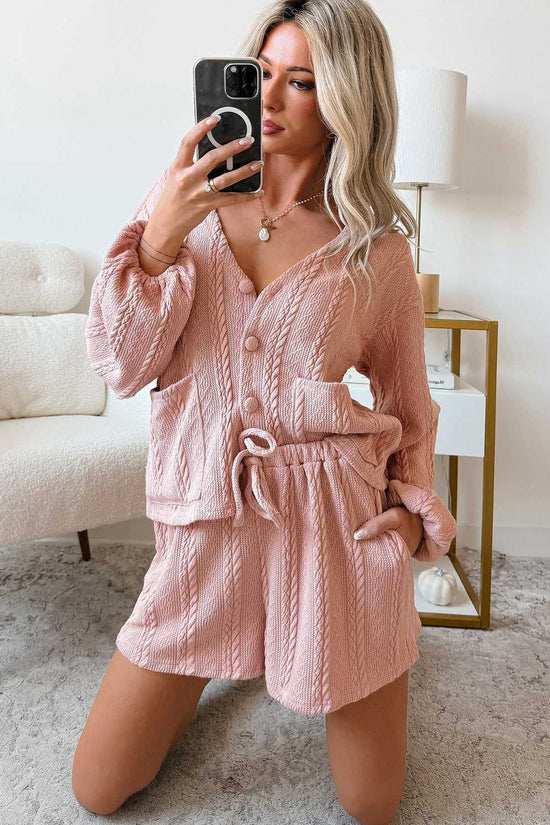 Woman wearing the Blush Pink Cable Knit Co‑Ord taking a mirror selfie, highlighting the soft knit texture and relaxed fit of the lounge set.