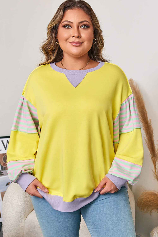 Comfort fit plus size yellow sweatshirt featuring pastel color block and stripe details, perfect for casual style.