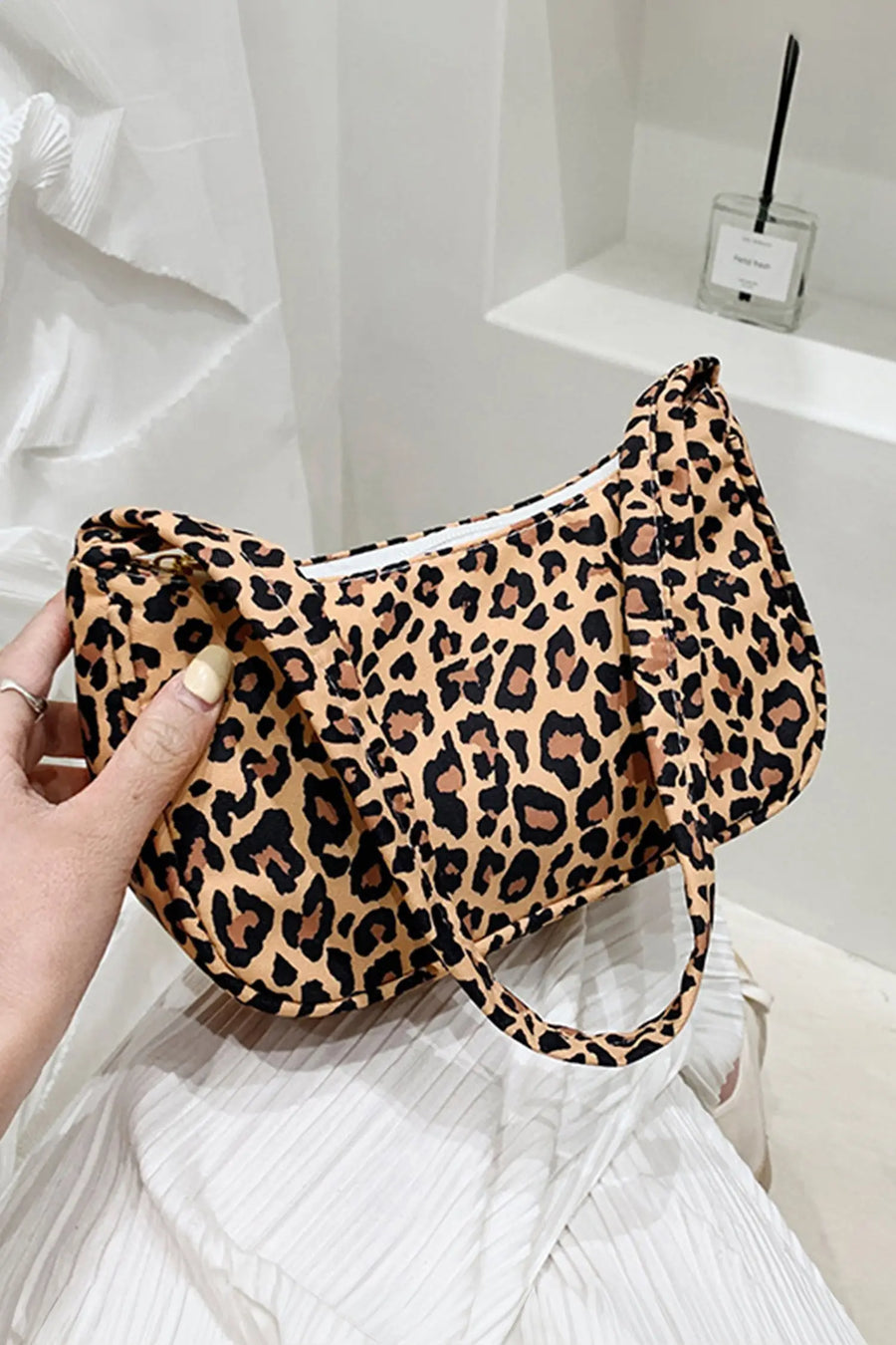Women's leopard print shoulder bag lifestyle shot casual