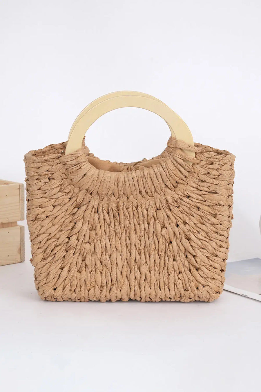 Women's straw woven bag detail view handle weave
