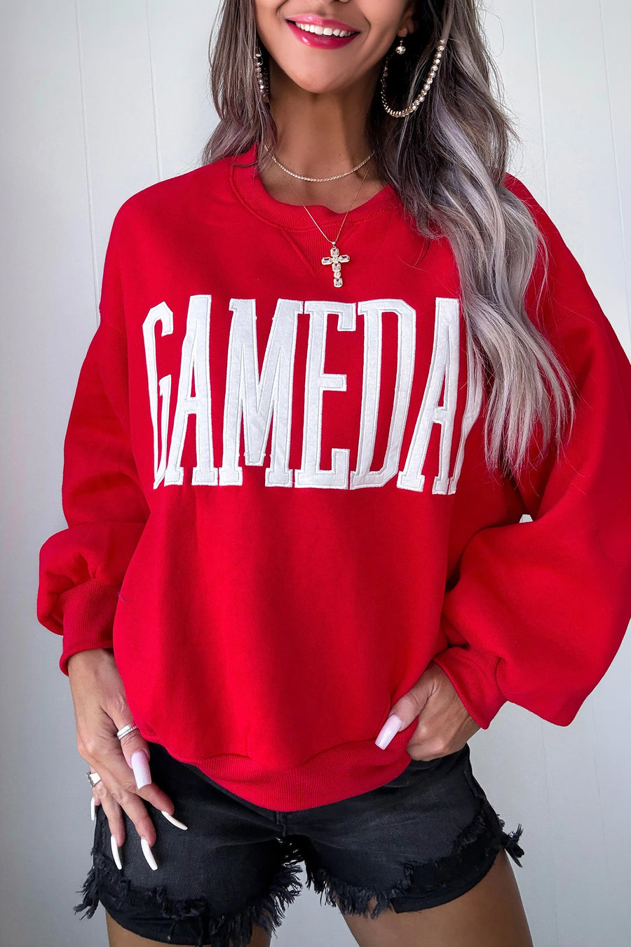 GAMEDAY embroidered patch sweatshirt — close-up of embroidered patch lettering detail