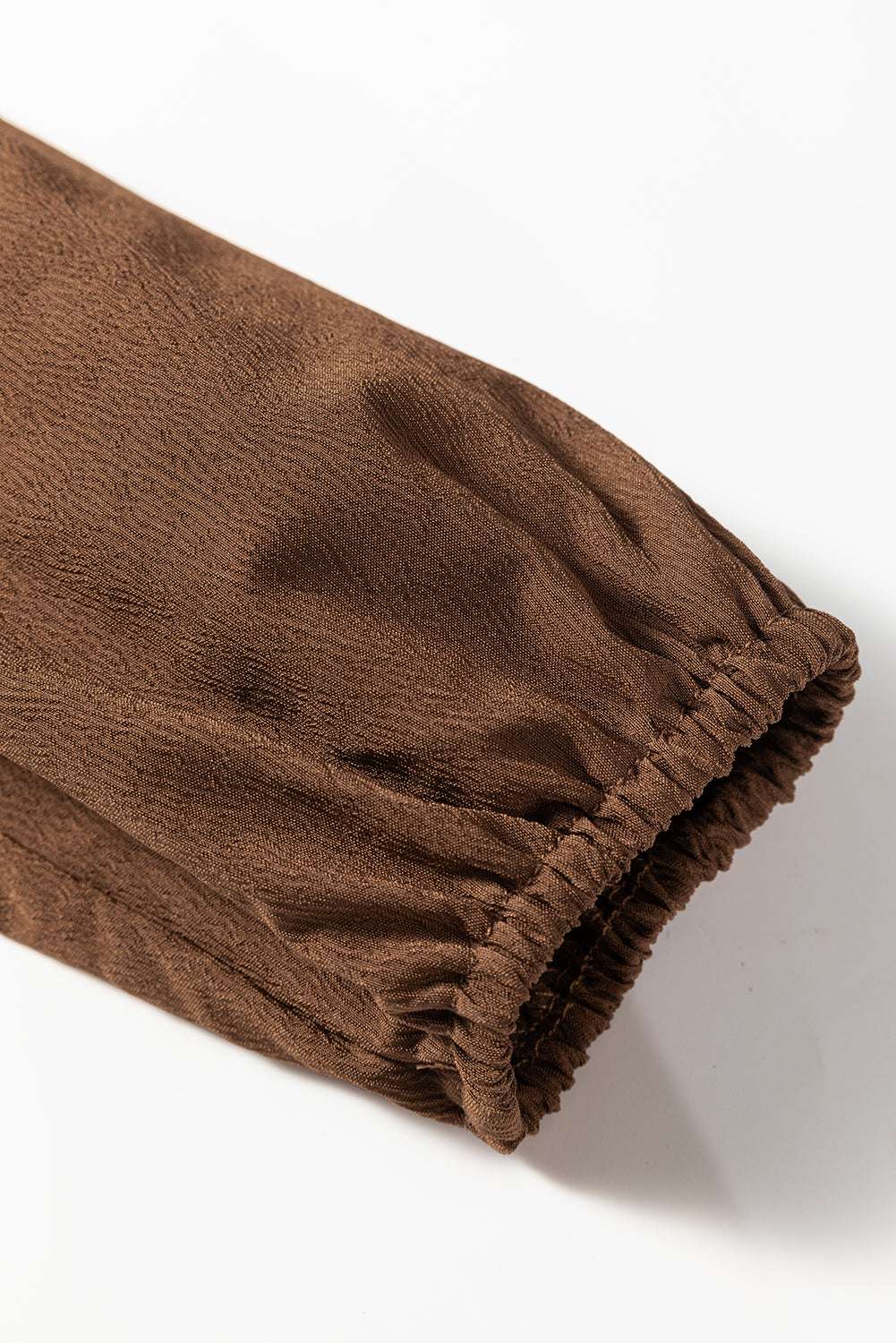 Elastic cuff detail on Brown Long Sleeve Tiered Maxi Dress sleeve, showcasing comfort and subtle texture for fall fashion.