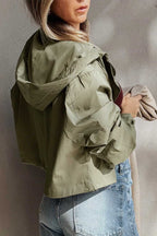 Back view of Cropped Hooded Utility Jacket in laurel green, highlighting relaxed fit and hood design for versatile autumn styling.