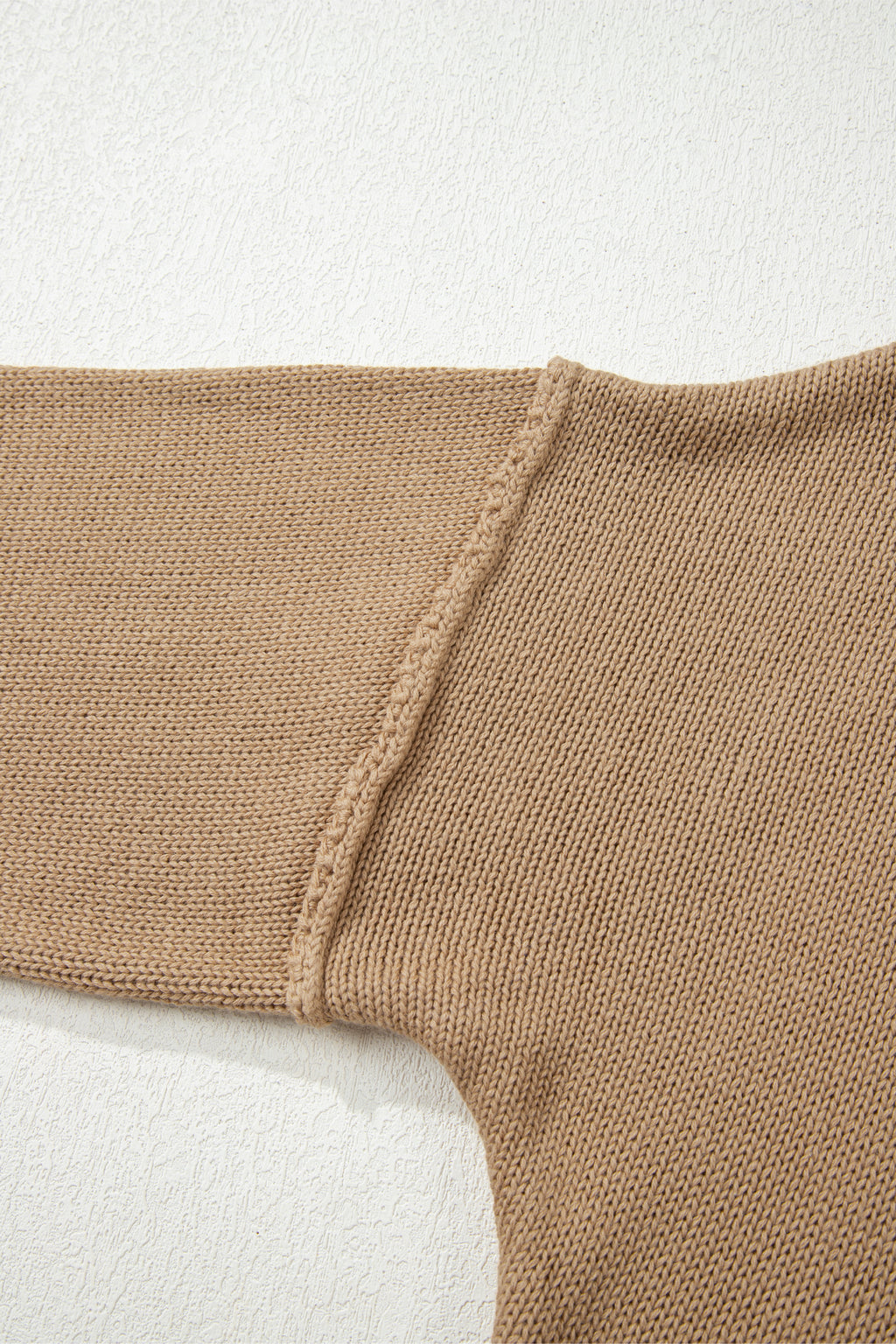 Close-up of a Khaki Oversized Jumper Dress on a light background