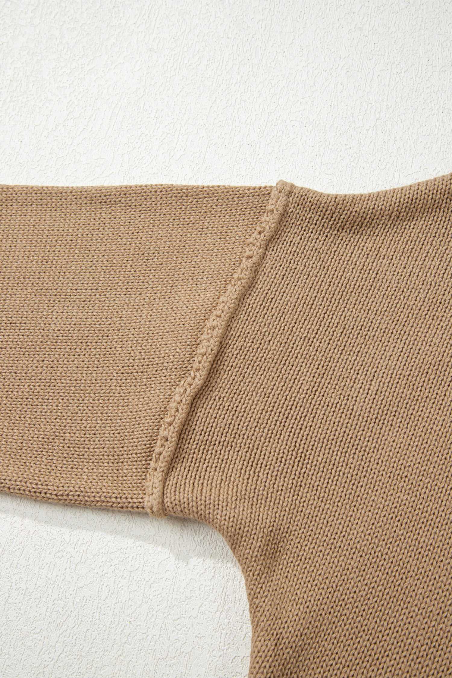 Close-up of a Khaki Oversized Jumper Dress on a light background